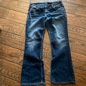 Silver dark wash jeans.